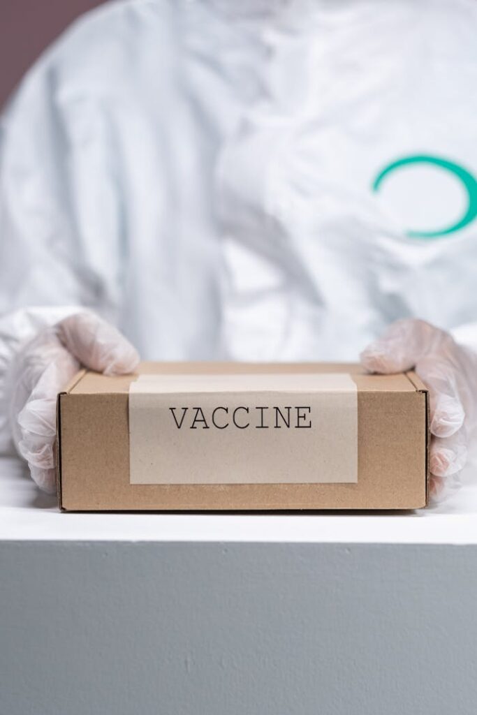 Close up on Vaccine Box in Human Hands